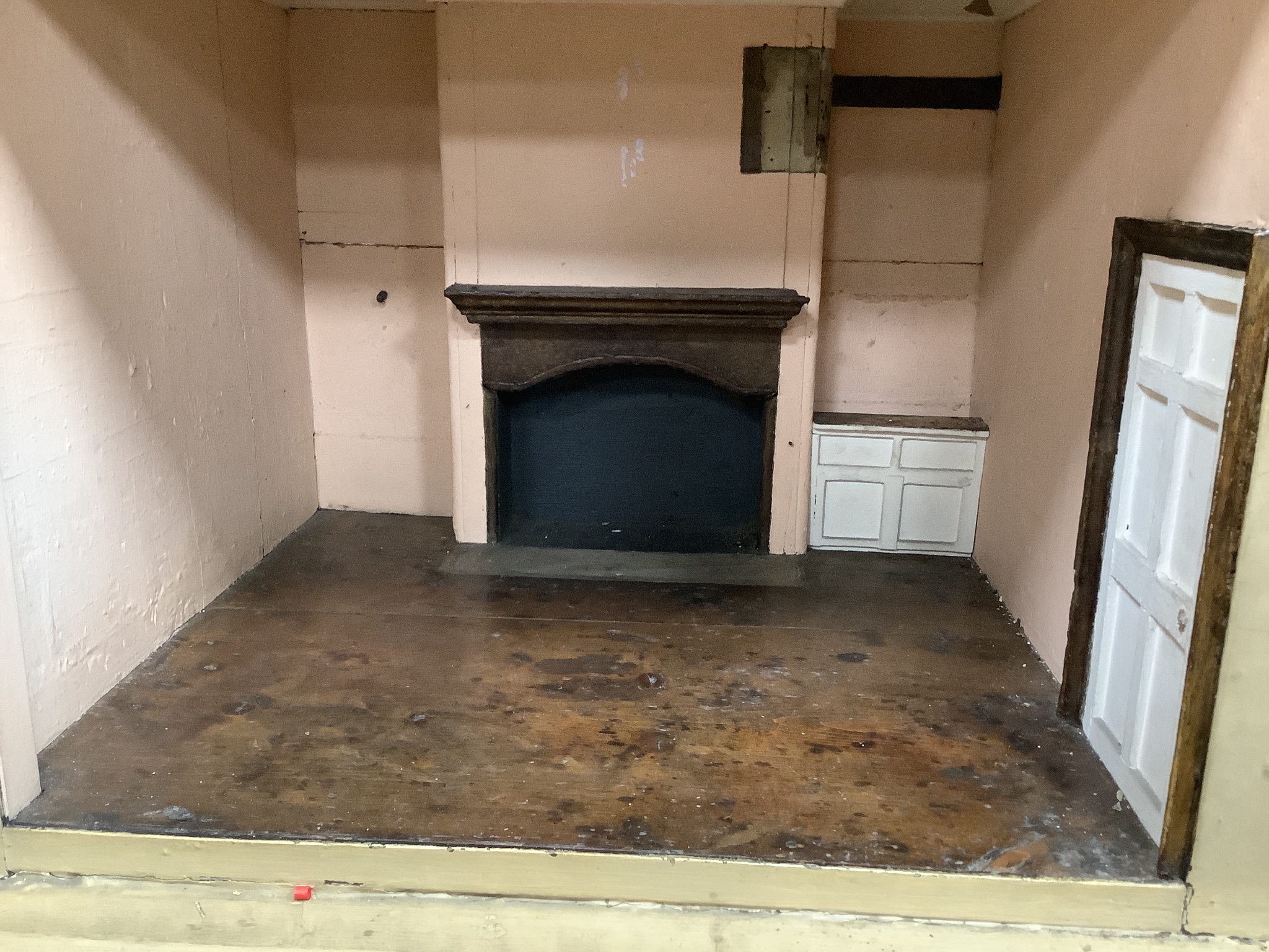 An early 19th century painted doll's house with block work facade enclosing a four room interior with central staircase, to be sold with assorted later furniture and accessories, width 117cm, depth 48cm, height with asso